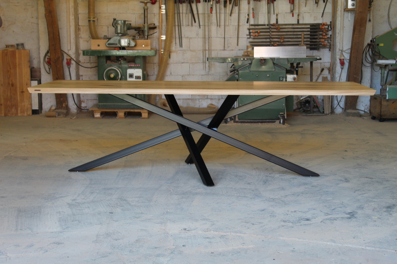 Large rustic timber dining table with black metal legs